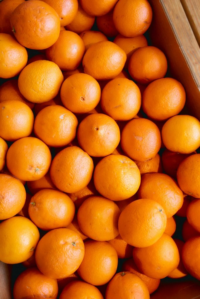 oranges sitting in a cluster