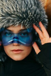 woman in winter wonderland with blue glasses