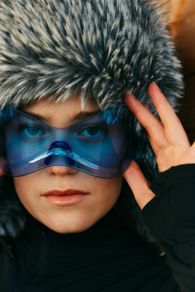 woman in winter wonderland with blue glasses